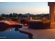 Pool with tiled spa and built in grill on patio with mountain views at sunset at 11290 N 117Th St, Scottsdale, AZ 85259