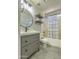 Bathroom featuring a shower with a bathtub, floating shelves, and modern vanity at 1212 S Boulder St # C, Gilbert, AZ 85296