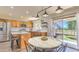 Bright kitchen featuring stainless steel appliances, wood cabinets, marble countertops, and a cozy dining area at 1212 S Boulder St # C, Gilbert, AZ 85296