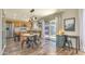 Well-lit eat-in kitchen offers stainless steel appliances, a desk area, and access to the backyard at 1212 S Boulder St # C, Gilbert, AZ 85296