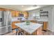 Bright kitchen with island, stainless steel appliances, and light wood cabinets at 1212 S Boulder St # C, Gilbert, AZ 85296