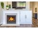 Living room with a fireplace and built-in storage, perfect for displaying decor and media at 1212 S Boulder St # C, Gilbert, AZ 85296