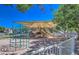 Community playground with multiple slides and climbing structure under a shaded canopy for safe fun at 1212 S Boulder St # C, Gilbert, AZ 85296