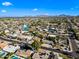 Expansive aerial view of a residential neighborhood showcasing well-maintained homes and tree-lined streets at 14830 N 28Th Pl, Phoenix, AZ 85032