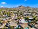 Aerial view of a residential community with lush landscaping, sparkling pools, and desert mountain views at 14830 N 28Th Pl, Phoenix, AZ 85032