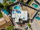 Aerial view of the home displaying the roof, landscaping, and several backyard swimming pools at 14830 N 28Th Pl, Phoenix, AZ 85032