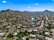Overhead view of a beautiful suburban neighborhood against a backdrop of majestic mountains at 14830 N 28Th Pl, Phoenix, AZ 85032