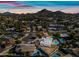 Aerial view showcases mountain views, neighborhood, and backyard pool at 14830 N 28Th Pl, Phoenix, AZ 85032