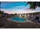 A spacious backyard with a refreshing pool, covered patio, and ample space for outdoor activities at 14830 N 28Th Pl, Phoenix, AZ 85032