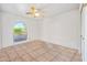 Bright bedroom with tile floors and a large arch window allowing natural light at 14830 N 28Th Pl, Phoenix, AZ 85032