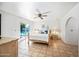 Bedroom with wooden bed frame and tile floors at 14830 N 28Th Pl, Phoenix, AZ 85032