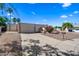 Single-story home featuring a two-car garage, arched entrance and low-maintenance desert landscaping at 14830 N 28Th Pl, Phoenix, AZ 85032