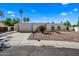 Front exterior of home featuring desert landscaping, arched entrance and two-car garage at 14830 N 28Th Pl, Phoenix, AZ 85032