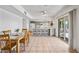 Open-concept space with kitchen featuring granite counters, gray cabinetry, and dining area with table set at 14830 N 28Th Pl, Phoenix, AZ 85032