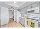Bright kitchen with stainless steel appliances, granite countertops and white cabinetry at 14830 N 28Th Pl, Phoenix, AZ 85032