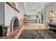 Open floor plan featuring a brick fireplace, open kitchen and dining area, and modern finishes at 14830 N 28Th Pl, Phoenix, AZ 85032