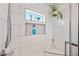 Shower with tile, seat and toiletries at 14830 N 28Th Pl, Phoenix, AZ 85032