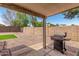 Covered patio overlooking a fenced backyard with gravel and a small section of artificial turf at 16160 W Custer Ln, Surprise, AZ 85379