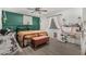 Stylish bedroom featuring a large bed with a decorative headboard and a vanity area at 16160 W Custer Ln, Surprise, AZ 85379