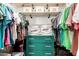Organized walk-in closet with custom shelving, drawers, and ample storage for clothing and accessories at 16160 W Custer Ln, Surprise, AZ 85379