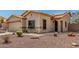 Charming single-story home featuring a red tile roof, stucco exterior, and low-maintenance desert landscaping at 16160 W Custer Ln, Surprise, AZ 85379