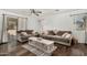 Bright living room with plush sofas, stylish coffee table, and modern decor at 16160 W Custer Ln, Surprise, AZ 85379