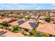 Expansive aerial view of a thriving neighborhood, featuring single-Gathering homes with desert landscaping and solar panels at 1771 E Alegria Rd, Queen Creek, AZ 85140