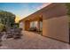 Expansive back patio perfect for entertaining, includes dining, lounge area and view of the backyard at 1771 E Alegria Rd, Queen Creek, AZ 85140