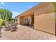 Expansive back patio perfect for entertaining, includes dining, lounge area and view of the backyard at 1771 E Alegria Rd, Queen Creek, AZ 85140