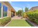 Beautiful backyard featuring a covered patio, dining area, green space, and desert landscaping at 1771 E Alegria Rd, Queen Creek, AZ 85140