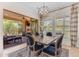 Stylish dining room with modern chandelier, large windows, and outdoor access at 1771 E Alegria Rd, Queen Creek, AZ 85140