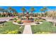 Beautiful community entrance featuring a tiered fountain surrounded by manicured lawns and decorative planters at 1771 E Alegria Rd, Queen Creek, AZ 85140