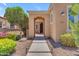 Inviting front entrance with well-maintained landscaping and a charming covered walkway at 1771 E Alegria Rd, Queen Creek, AZ 85140