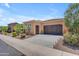 Charming single-Gathering home with a two-car garage and desert landscaping at 1771 E Alegria Rd, Queen Creek, AZ 85140