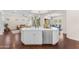 Bright kitchen island with sink, seating, and stainless steel dishwasher at 1771 E Alegria Rd, Queen Creek, AZ 85140