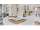 Close up of kitchen island showcasing elegant place settings and modern decor at 1771 E Alegria Rd, Queen Creek, AZ 85140