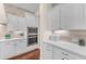 Modern kitchen featuring stainless steel appliances, ample counter space, and white cabinetry at 1771 E Alegria Rd, Queen Creek, AZ 85140
