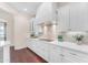Updated kitchen featuring white cabinets, sleek countertops, and modern appliances at 1771 E Alegria Rd, Queen Creek, AZ 85140