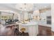Gourmet kitchen with large island, white cabinets, and open access to dining area at 1771 E Alegria Rd, Queen Creek, AZ 85140