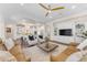 Open-concept living room featuring a seamless connection to the kitchen and dining areas at 1771 E Alegria Rd, Queen Creek, AZ 85140