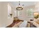 Bright and stylish living room with hardwood floors and large windows offering great light at 1771 E Alegria Rd, Queen Creek, AZ 85140