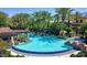 Luxurious swimming pool surrounded by palm trees, lounge chairs, and cozy cabanas for ultimate relaxation at 1771 E Alegria Rd, Queen Creek, AZ 85140
