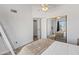 Bright bedroom with mirrored closet, vaulted ceilings, and balcony access at 1800 W Elliot Rd # 240, Chandler, AZ 85224