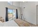 Bright bedroom with vaulted ceilings, a ceiling fan, and access to an outdoor balcony at 1800 W Elliot Rd # 240, Chandler, AZ 85224