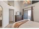 Bedroom featuring a ceiling fan, sliding glass door leading to a balcony, and neutral decor at 1800 W Elliot Rd # 240, Chandler, AZ 85224