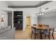 Dining area featuring a round wooden table, modern lighting and a built-in bar at 1800 W Elliot Rd # 240, Chandler, AZ 85224