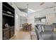Cozy living room featuring a dining area and an open kitchen with modern lighting and neutral color palette at 1800 W Elliot Rd # 240, Chandler, AZ 85224