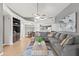 Open-concept living room with a fireplace, spacious seating, and a view of the kitchen at 1800 W Elliot Rd # 240, Chandler, AZ 85224