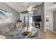Bright living room featuring a fireplace, ceiling fan, and sliding doors at 1800 W Elliot Rd # 240, Chandler, AZ 85224