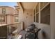 Cozy balcony featuring stylish furniture and charming hummingbird decorations at 1836 N 77Th Gln, Phoenix, AZ 85035